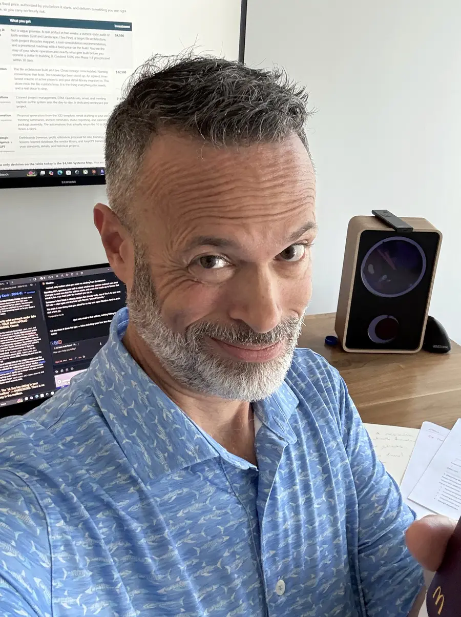 Adam LaBare at his desk, smiling